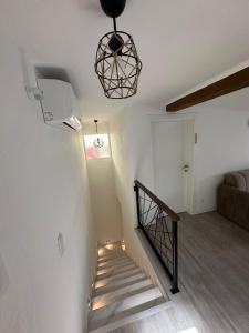 a stairway with a stair light and a stair case at Čaršija Light Visoko in Visoko