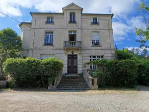 an old house with stairs in front of it at Maison Vive La Vie in Couiza