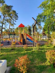a playground with a slide in a park at "Ламази"Домашняя гостиница in Kobuleti
