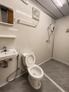 a bathroom with a toilet and a sink at NearBKKHomestayAirport in Bang Phli +21 photos