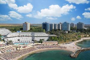 an aerial view of a resort with a beach and buildings at Olimp Panoramic Sea View in Olimp