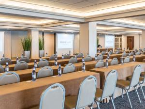 a conference room with tables and chairs in it at Mercure Monte Igueldo in San Sebastián +146 photos
