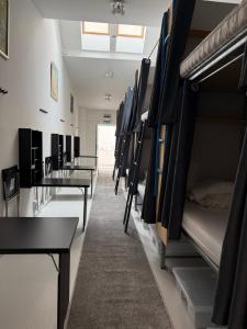 a room filled with lots of bunk beds at The Old Factory in Copenhagen