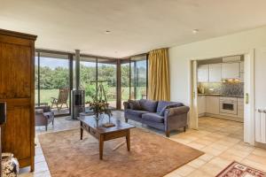 a living room with a couch and a table at Villa Greta in Navata