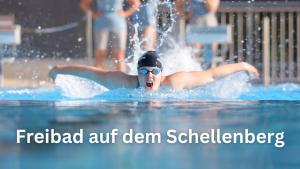 a woman swimming in a pool in the water at Boardinghouse Schellenberg in Donauwörth