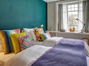 Postel nebo postele na pokoji v ubytování Hotel Anker Luzern