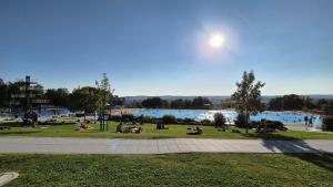 a group of people sitting on the grass in a park at Boardinghouse Schellenberg in Donauwörth