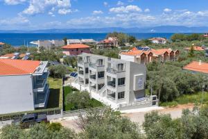 an aerial view of a white apartment building at Aeliana Thassos Studios & Lofts in Skala Rachoniou