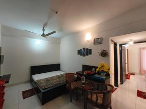 a small room with a bed and a table at World Beach Resort in Cox's Bazar