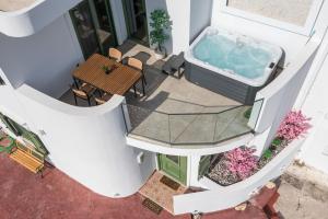 an overhead view of a hot tub on a building at Aegora Residence in Kalithies