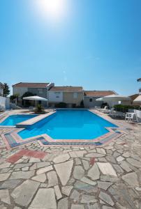 a swimming pool in a villa with a resort at Siviri Azure Sea View by Luxlikehome in Siviri