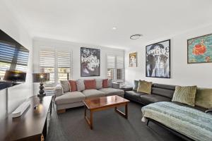 a living room with a couch and a table at Rileystone in Margaret River Town