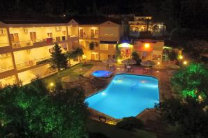 an aerial view of a swimming pool at night at Hotel Evridiki in Fourka
