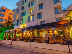 a restaurant in front of a building at Alan Suites in Edirne