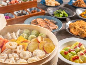 a table topped with bowls of different types of food at HOTEL MYSTAYS Soga in Chiba +45 photos