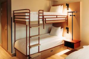 a room with three bunk beds in it at Scandic Go, Kungsgatan 14 in Jönköping +22 photos