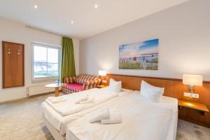 Postel nebo postele na pokoji v ubytování Hotel Königslinie