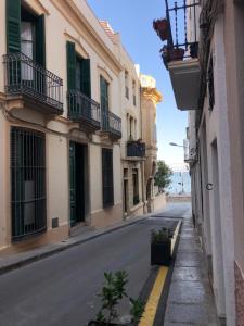 an empty street in a city with buildings at Casa l'àvia - Sant Pol de Mar in San Pol de Mar