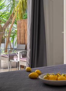 a table with a plate of fruit on top of it at Australia in Skiathos