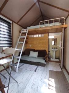 a room with a bunk bed and a ladder at Chillsteps Hostel in Fethiye +83 photos