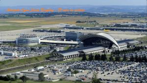 an aerial view of an airport with a parking lot at L'appartement de Maya in Saint-Priest