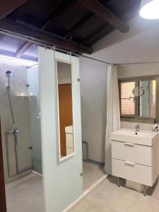 a bathroom with a sink and a shower at 海軍官邸眷村民宿 in Nan-men +82 photos