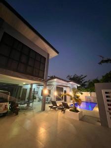 a patio of a house at night at Rams home in Moalboal