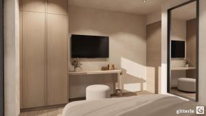 a bedroom with a bed and a tv on a wall at Augusta Apartments in Fliess +16 photos