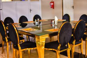 a conference room with a table and chairs at MKHUZE INN in Mkuze +32 photos