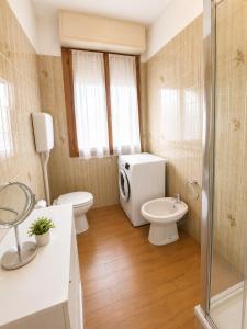 a bathroom with a toilet and a sink and a shower at Casa Eliana - Camporosso in Camporosso +8 photos