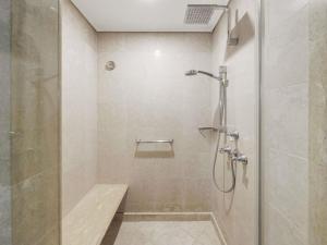 a shower with a glass door in a bathroom at Pullman Reef Hotel Casino in Cairns +102 photos