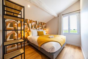 a bedroom with a bunk bed and a window at La Maison Blanche in Saint-Sulpice-de-Faleyrens +21 photos