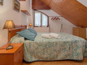 a bedroom with a bed with two pillows on it at Villa Rubén in Miengo
