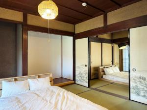 a bedroom with a bed and a mirror at #12 Sekigahara Hotaru in Sekigahara