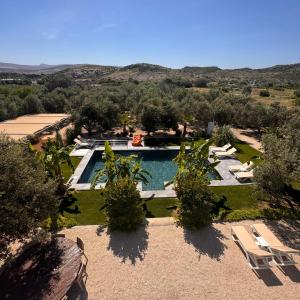 an aerial view of a resort with a swimming pool at Alaçatı Beka House in Alaçatı +39 photos