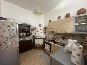 a kitchen with a refrigerator and a stove at Casa San Francesco in Agnone