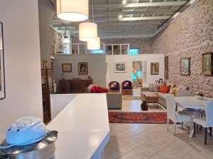 a living room with a couch and a table at Sea & Sun in Gialova