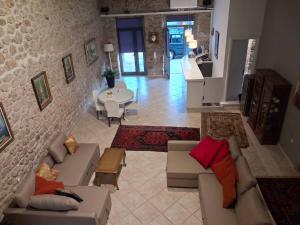 a living room with couches and a table at Sea & Sun in Gialova