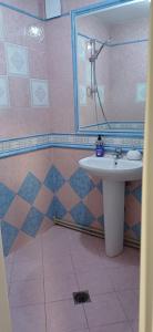 a bathroom with a sink and a shower at Шанс in Velingrad