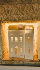 a model of a house on a table at Istria Stone House in Marasi