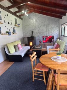 a living room with a couch and a table at Kuća za odmor-Aleksandra in Divčibare