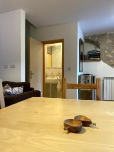 a wooden table with two shoes on top of it at Istria Stone House in Marasi