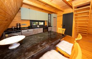 a kitchen with a counter top and a stove at Begonvil Gümüşlük in Gümüşlük
