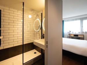 a bathroom with a shower and a sink at ibis Paris Gare de Lyon Diderot in Paris +54 photos