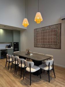 a dining room with a table and chairs at escape gabala in Vǝndam