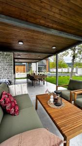 a living room with a couch and a table at escape gabala in Vǝndam
