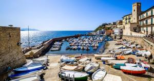 a bunch of boats are docked in a harbor at Piombino Monolocale Poseidonia in Piombino