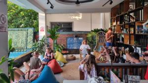 a group of people sitting in a room at LOTUS SERENITY Hostel in Siem Reap