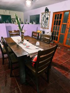 a dining room with a table and chairs at Hare Maohi in Hanga Roa