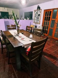 a dining room with a table and chairs at Hare Maohi in Hanga Roa